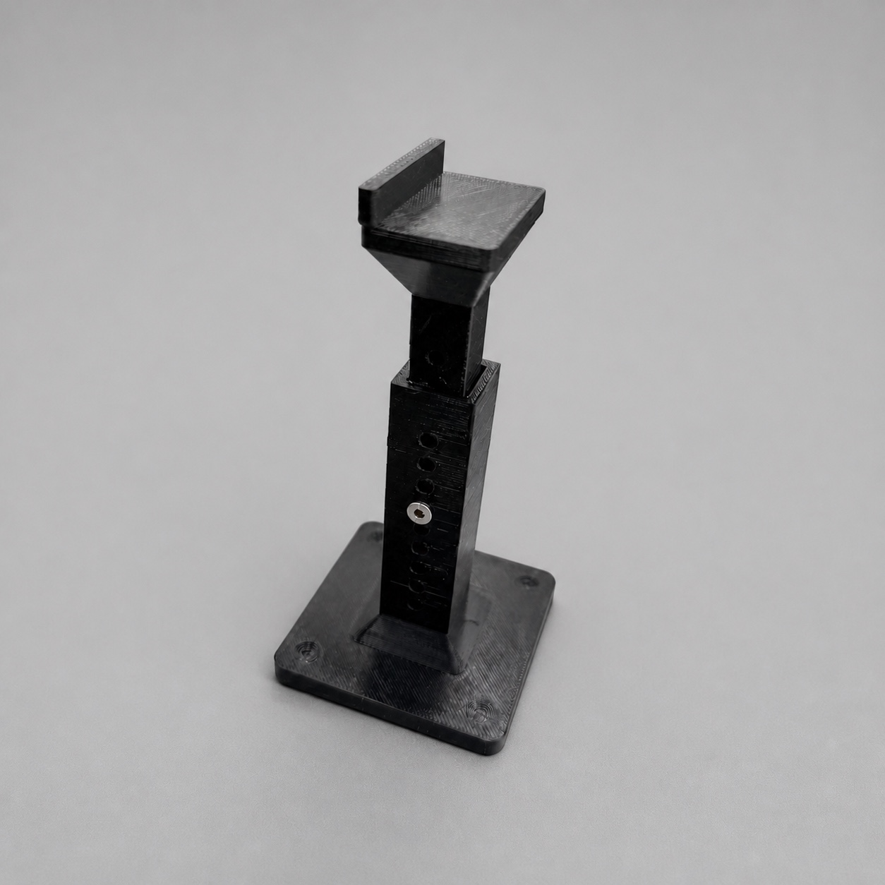Black PC-FR telescoping GPU support on a neutral gray studio surface